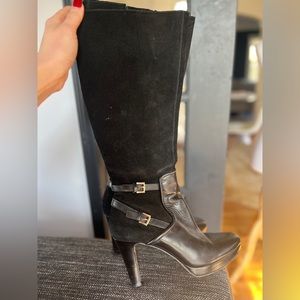Black tall leather and suede calf height platform boots.